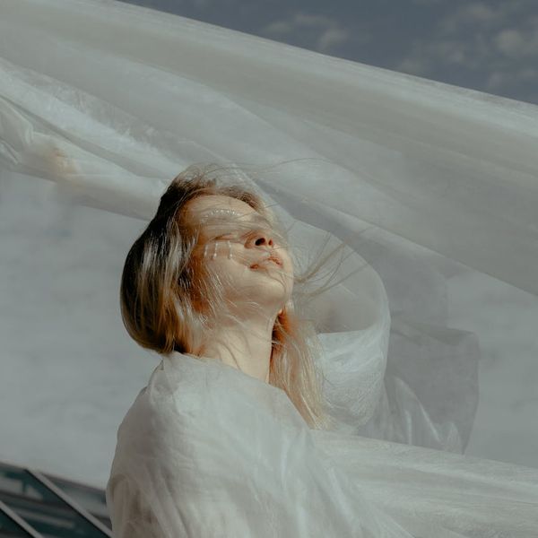 Person feeling serene and energetic in a natural outdoor setting.